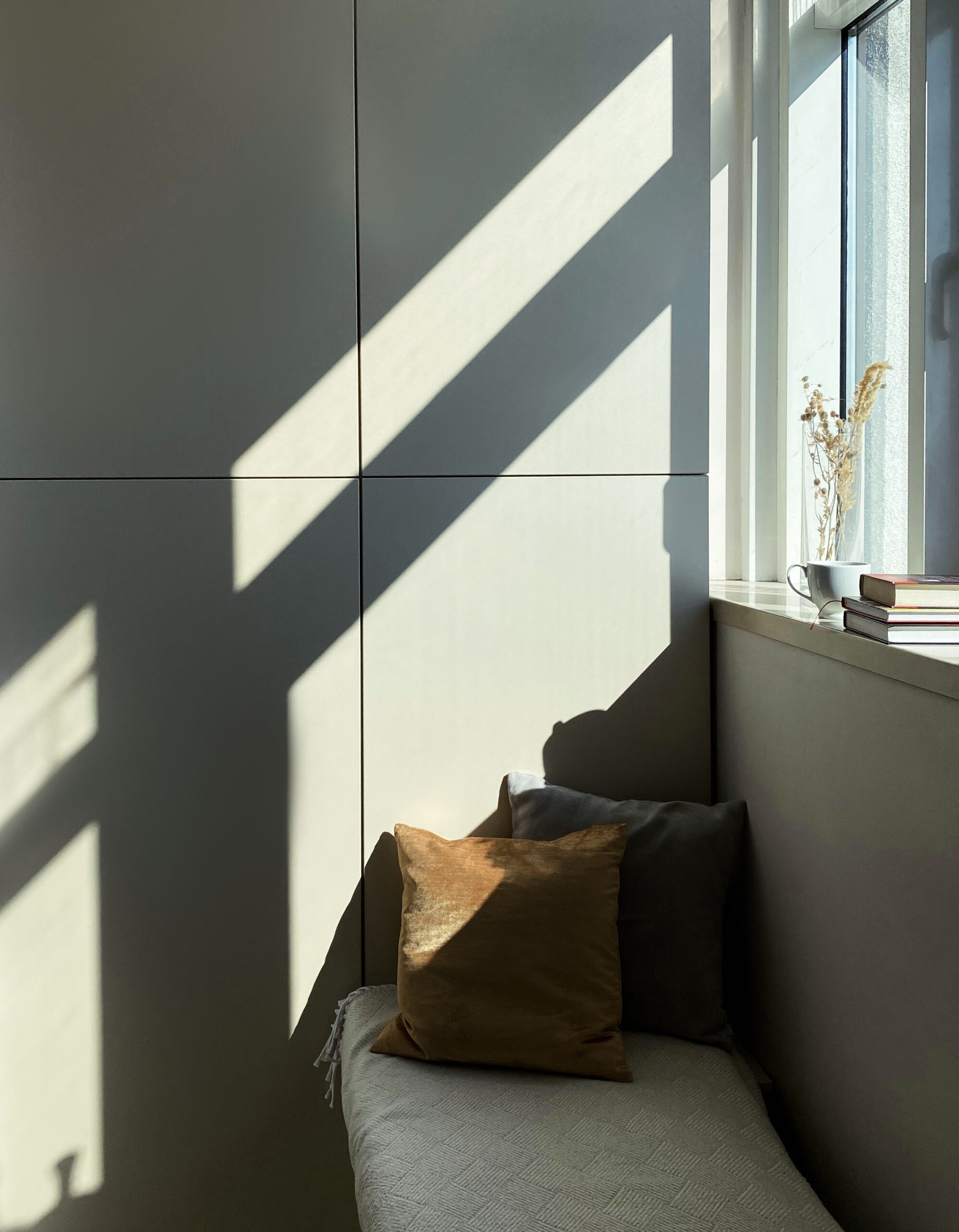 Bench with cushions by the window in modern apartment home-staging_64